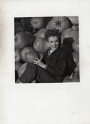 Marilyn Monroe original bw photograph showing Marilyn seated holding a pumpkin in her hand^ smiling