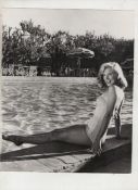 Marilyn Monroe original bw photograph showing Marilyn in swimming costume sitting by the side of a