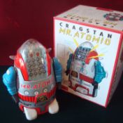 Cragstan (Japan) Mr Atomic Thinking Robot: Battery operated tinplate robot is silver, with red trim,