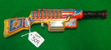 Sparkling Space Gun: Tinplate colourful clockwork gun Made in England 30cm