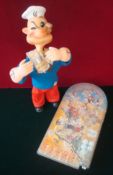 Max Carl (Germany) Rubber clockwork Popeye figure: Standing 27cm tall, blue shirt, red pants,