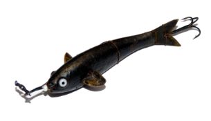 LURE: Early Gutta Percha hard rubber lure 3.5? long incl. metal curved tail twin white glass eyes