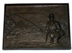 BRONZE: Cast bronze plaque by A. Cohen of London depicting an angler fishing in river scene stamped