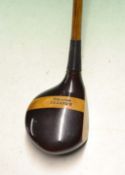 Fine Ben Sayers large dark stained socket head brassie c/w modern full length leather grip.