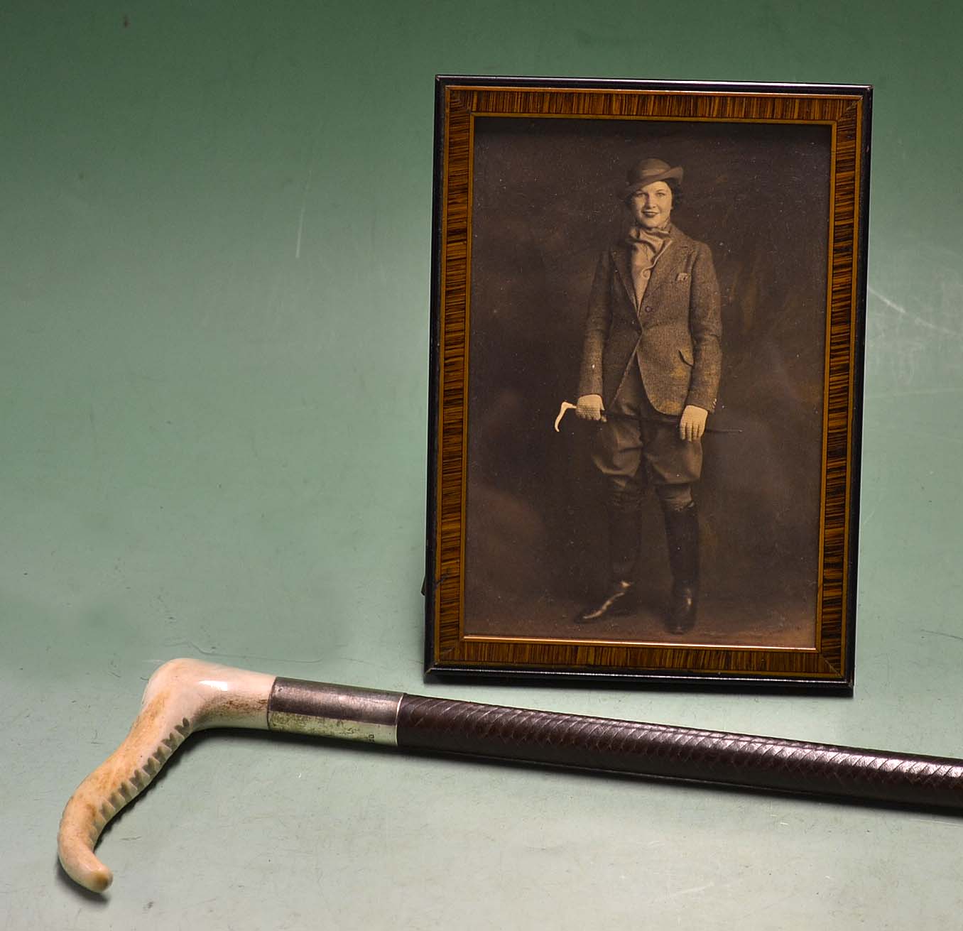 Hunting – Interesting portrait photograph of young lady dressed in hacking jacket, jodhpurs, boots