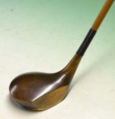 Fine and unusual oversize dark stained shallow face persimmon driver fitted with split cane shaft