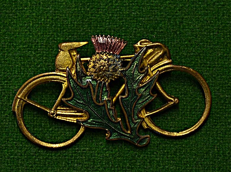 Cycling – Scottish brass and enamel cycling brooch – featuring drop handle bicycle mounted with