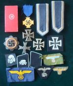 Selection of German Metal and Cloth Badges: To include 1st Class Iron Cross, Collier tabs, Gold