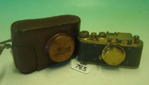 Reproduction Leica Camera: Gilt example of a Leica housing Brown leather Case complete with Strap