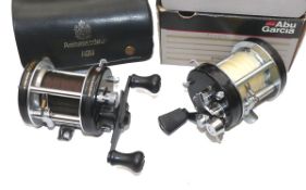 REELS: (2) An Abu Ambassadeur Sweden 6000C multiplier reel, black finish 3 screw end plate, foot