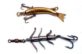 LURES: (2) Patent Titbit curved metal hollow bait, 2" body, twin trebles to sides, central trace,