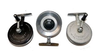 REELS: (3) Collection of 3 x S.E. Cooke Products Loncast twisting foot alloy reels, in grey, black