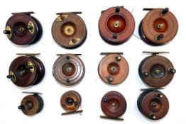 REELS: (12) Collection of 12 English Nottingham pattern wood and brass reels, sizes 3.5" down to 2",