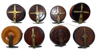 REELS: (8) Collection of 8 English Nottingham pattern wood and brass reels, sizes 3.5" to 4"