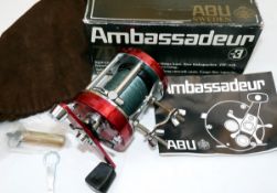 REEL: Abu Ambassadeur 7000 multiplier sea reel, foot stamp 790501, smooth red end plates, free spool