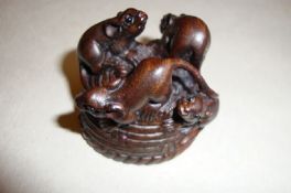 Japan ? Netsuke a particularly fine carved hard wood netsuke comprising four mice on an upturned