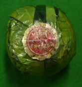 Made in England lattice pattern golf ball in the original green paper/cellophane wrapper