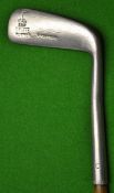 The `Giraffe` blade putter with 5.75` hosel and fitted with an unusual ridged back grip section