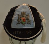 1979/80 Cardiff RFC Rugby Cap â€“ blue and black segments with crest, silver braid trim and