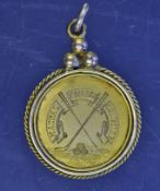 Madras College St Andrews yellow metal golf medal â€“ the obverse is engraved with Club`s banner,