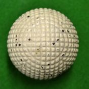 Unnamed and fine square mesh moulded guttie golf ball c. 1890 â€“ retaining most of the original