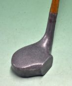 Rare and unusual alloy mallet head putter with small rectangular central forward projected face