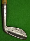 Unusual Winton high crown dropped toe wide flanged putter showing punch dot marks to the face and