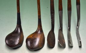 Half set of clubs comprising of 2 x woods a driver and a striped topped spoon, a three iron, a super