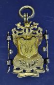 Ornate 1896 silver gilt golf medal â€“ mounted with golf clubs, balls and raised shield engraved