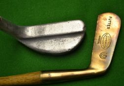 A Gunmetal straight blade putter marked with the `Thistle` and oval gold medal exhibition stamp to