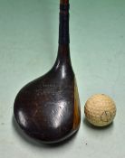 A Tingey Giant shallow head persimmon lofted driver fitted with a full length replaced hide grip,