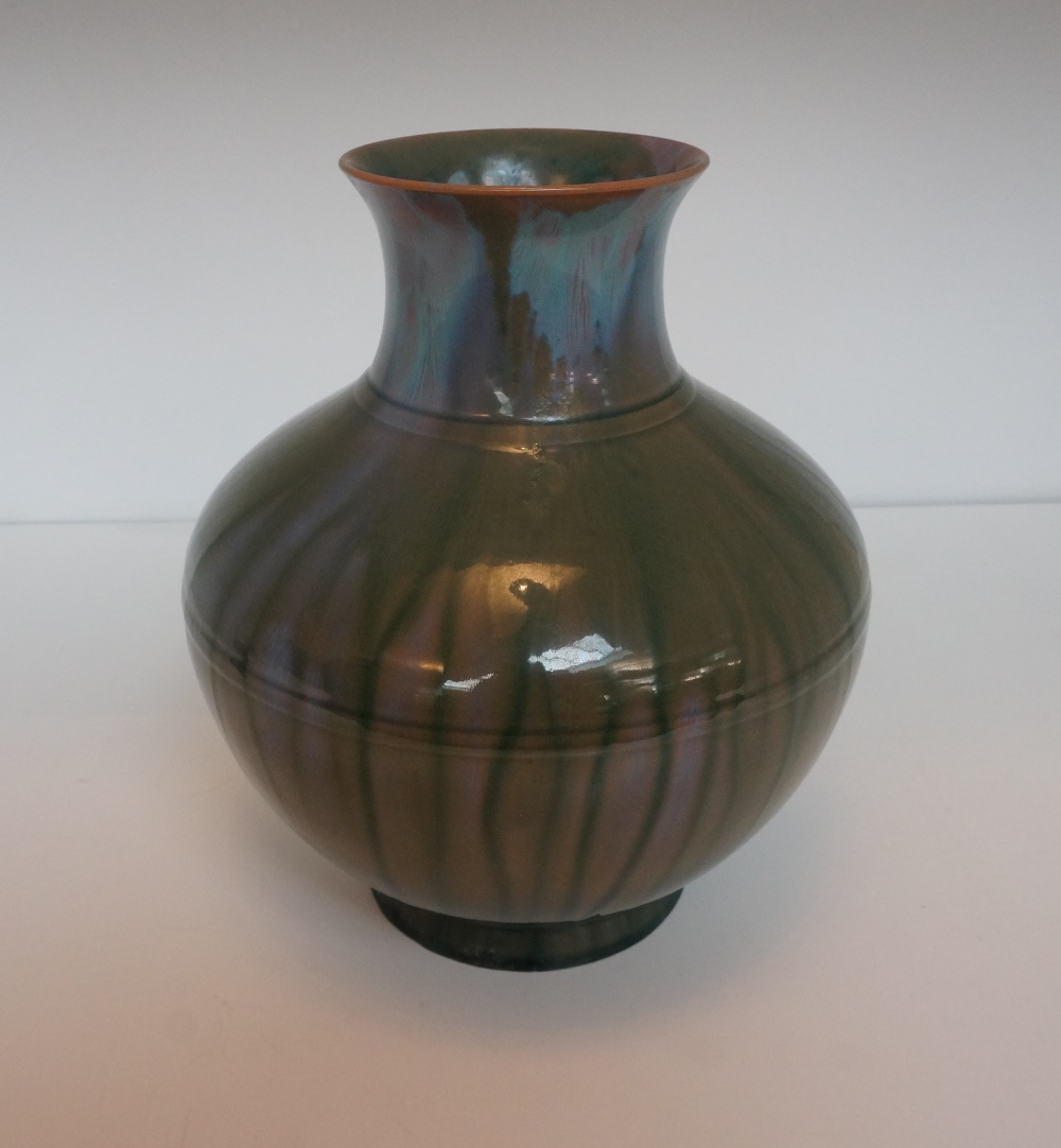 PILKINGTONS ROYAL LANCASTRIAN POTTERY VASE
circa 1908, with a green and puce ground on a waisted