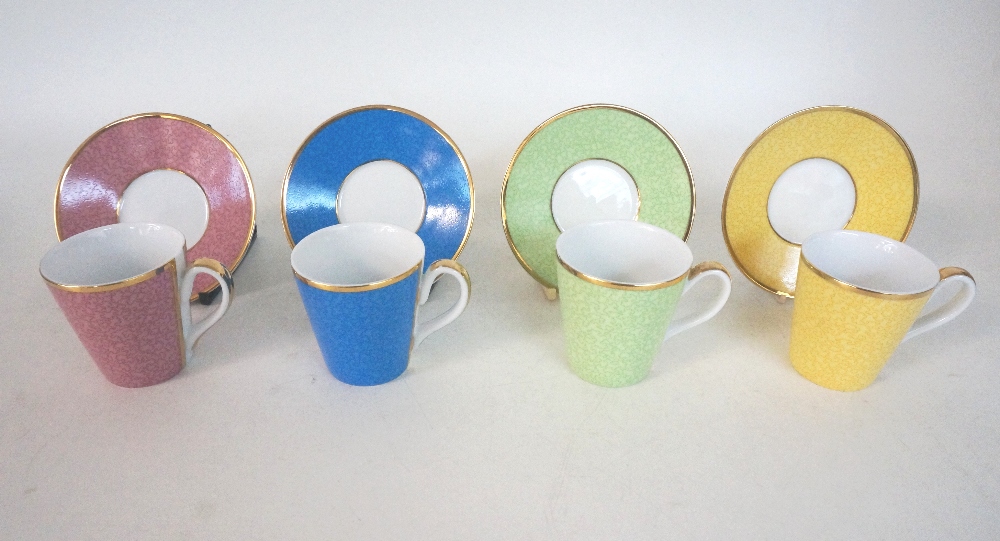 CASED SET OF ROYAL WORCESTER COFFEE CANS AND SAUCERS
decorated in vibrant colours with gilt rims, to