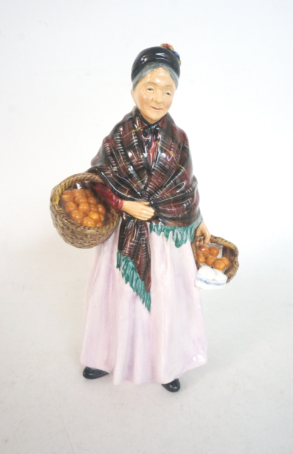 ROYAL DOULTON FIGURINE OF THE ORANGE LADY
HN1759, the lady with a shawl and carrying two baskets