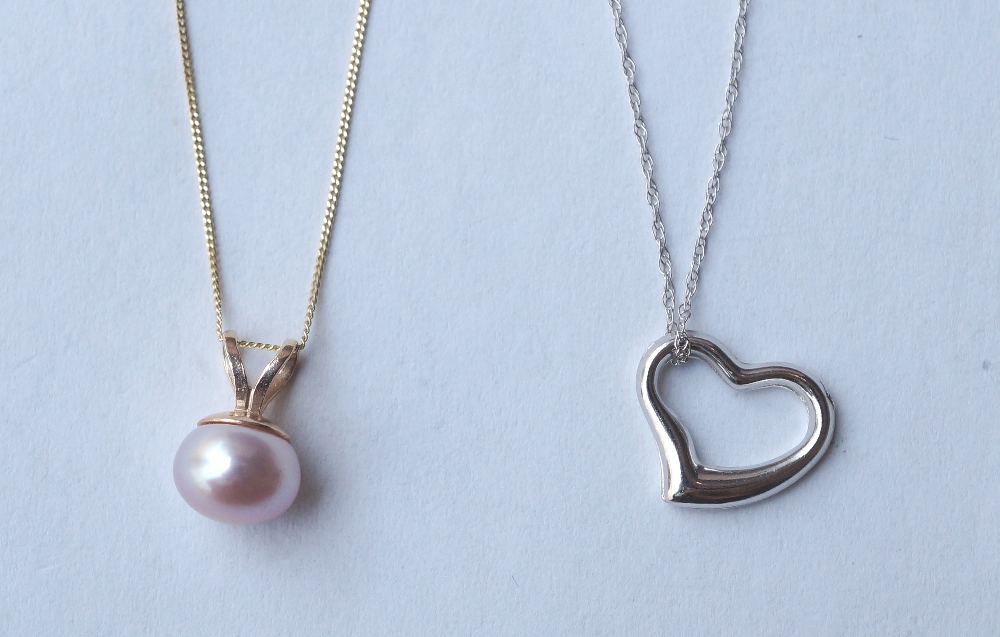 NINE CARAT WHITE GOLD HEART SHAPED PENDANT
on nine carat white gold chain, and a pink cultured pearl