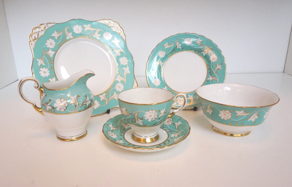 TUSCAN PORCELAIN TEA SET
comprising eight tea cups and six saucers, six side plates, sandwich plate,