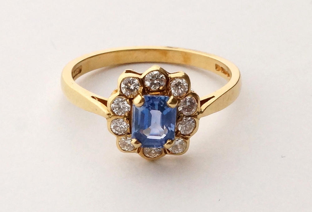 SAPPHIRE AND DIAMOND CLUSTER RING
the central sapphire in ten diamond surround, on eighteen carat