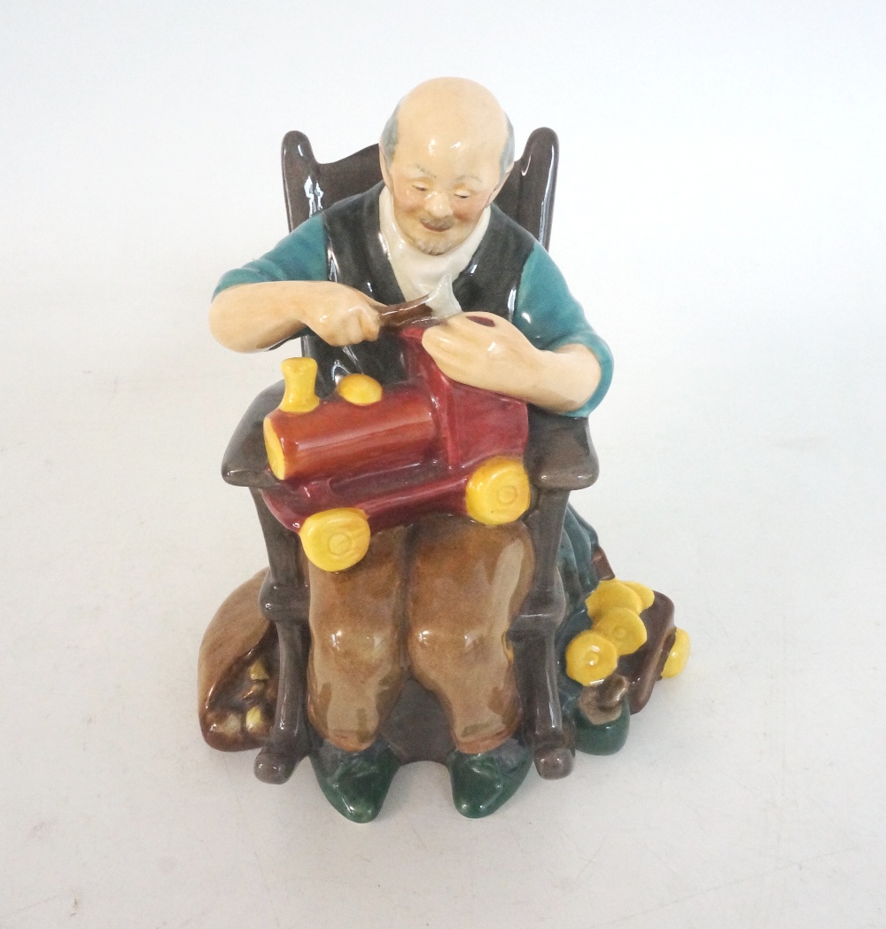 ROYAL DOULTON FIGURINE OF THE TOY MAKER
HN2250, sat in his rocking chair making a toy train with his