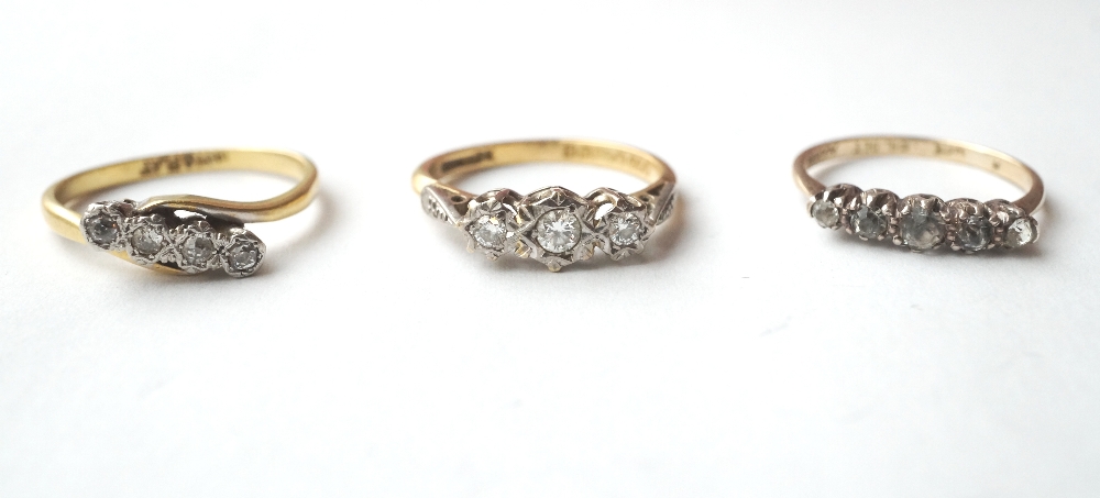 DIAMOND THREE STONE AND DIAMOND FOUR STONE RINGS
both on eighteen carat gold shanks; and a gem set