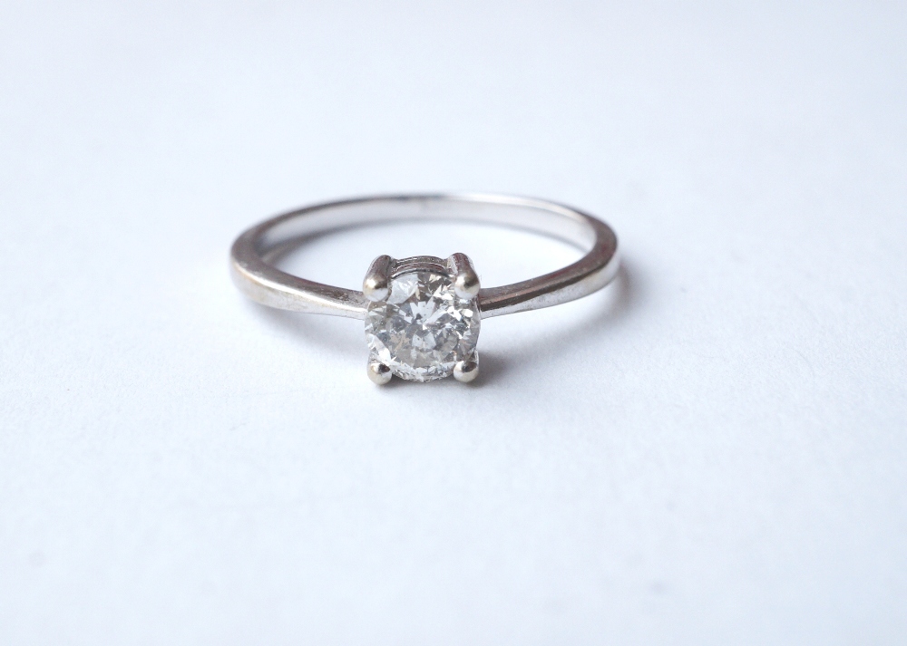 DIAMOND SOLITAIRE RING 
the round brilliant cut diamond approximately 0.5cts, on nine carat white