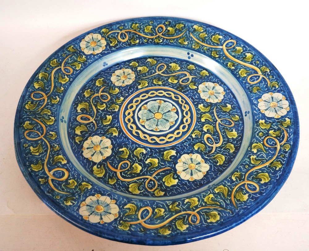 LARGE SICILIAN POTTERY WALL CHARGER
with colourful handpainted flower head and foliate decoration,