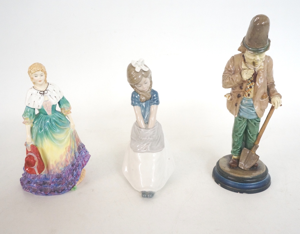 LLADRO FIGURINE
of a young girl with an apron seated on a barrel, 19cm high; a Paragon figurine of