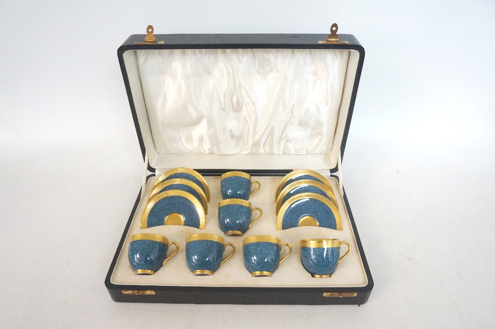 CASED SET OF SIX ROYAL WORCESTER COFFEE CANS AND SAUCERS
each decorated in mottled blue and gilt