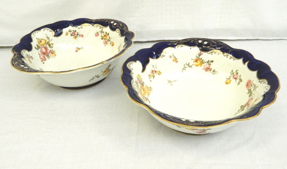 PAIR OF GEORGE JONES TOILET BOWLS 
with colourful floral decoration overall on a deep blue ground