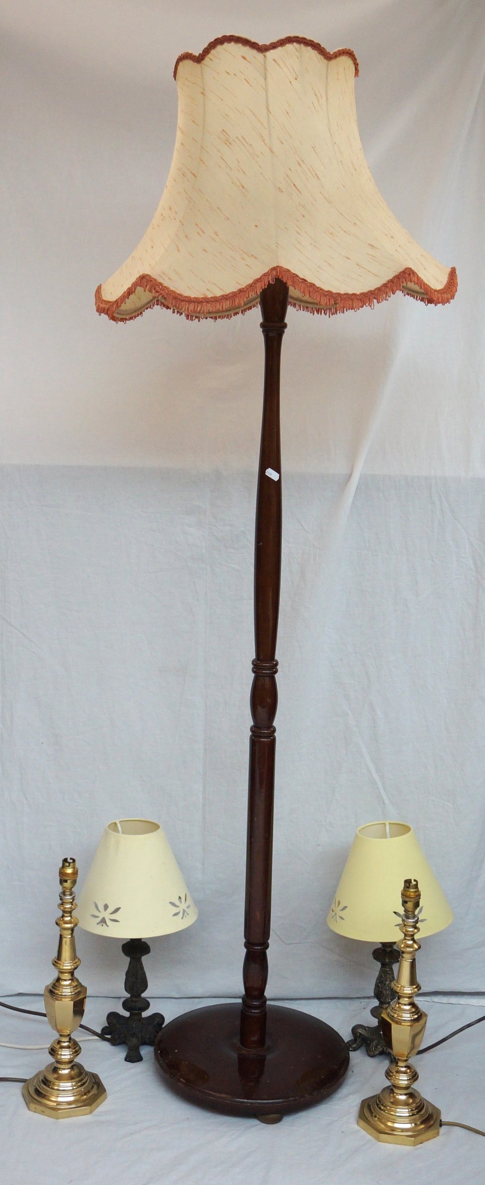 PAIR OF BRASS LAMPS
of shaped form with shades, together with a pair of gilded table lamps on tripod