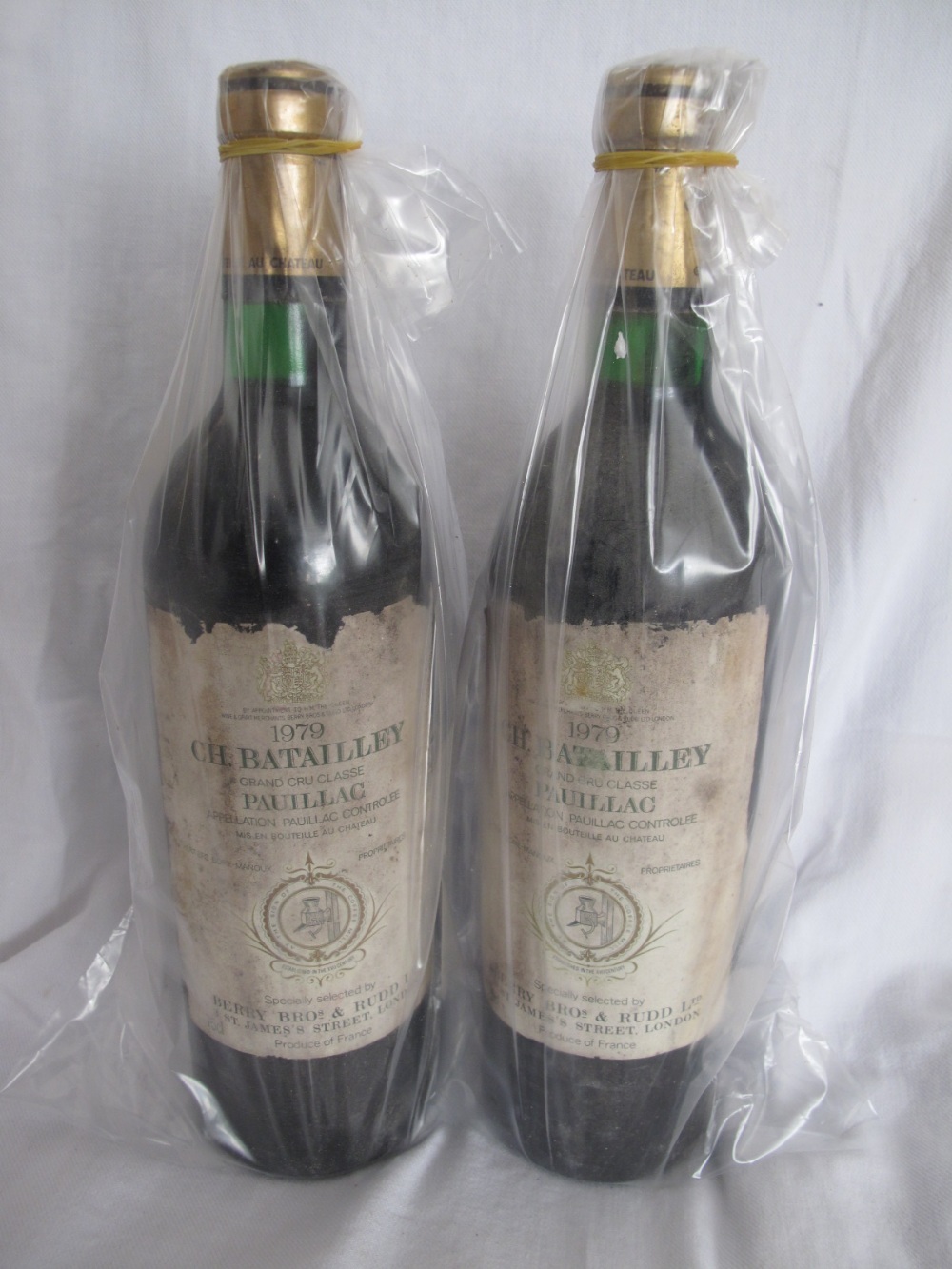 Two bottles Ch. Batailley 1979 Grand Cru Classe, ullage above bottom of neck