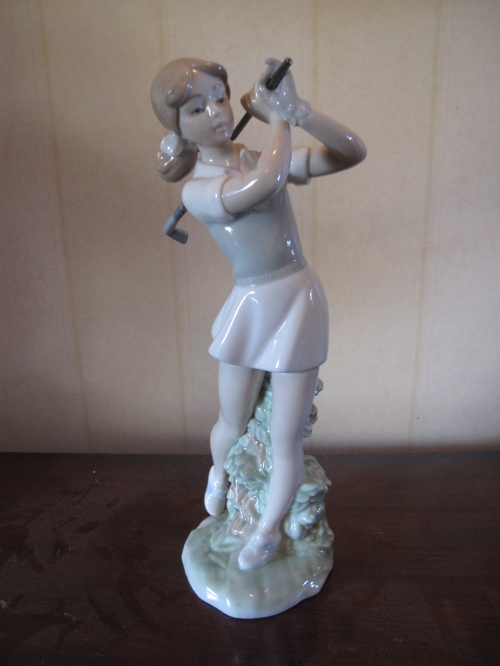 Nao figure of a lady golfer. height 9.5ins.