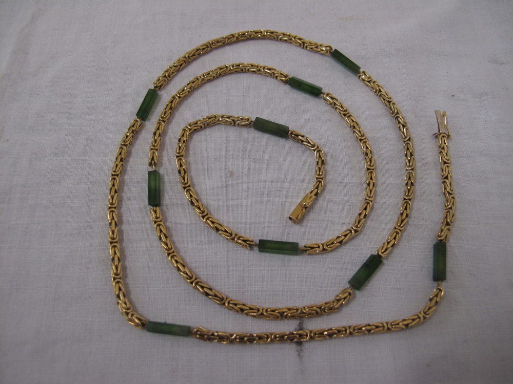 Fancy link 15ct gold chain with Jade baton bead decoration. Length 32 ins. 53 gms.
