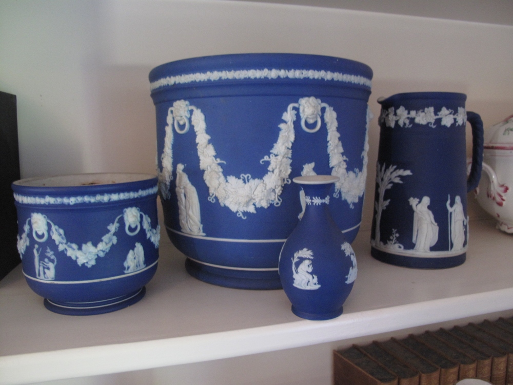 Collection of four items of dark blue Jasperware by Wedgwood two Jardinieres, Jug & Vase