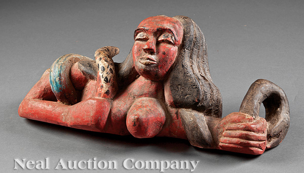 A Mende Polychrome Painted Carved Wood Mami Wata Spirit Figure, Sierra Leone, reclining female